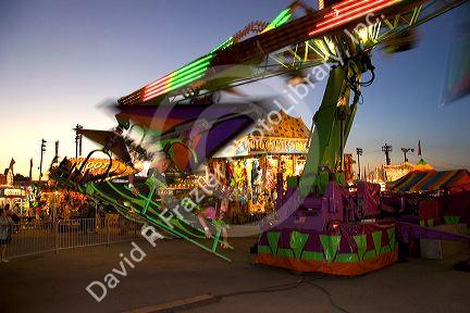 Children on a  thrill ride at the Iowa state fair in Des Moines.