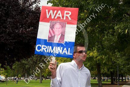 Man holding a sign at an Anti-war protest in Salt Lake City, Utah. 8/22/2005