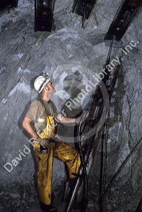 Miner installs rock bolts for support inside the Lucky Friday Silver Mine in Wallace, Idaho.