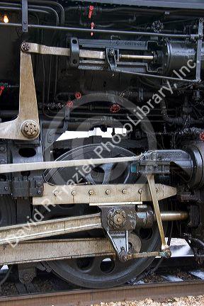 Close up detail view of a steam locomotive drive wheel.