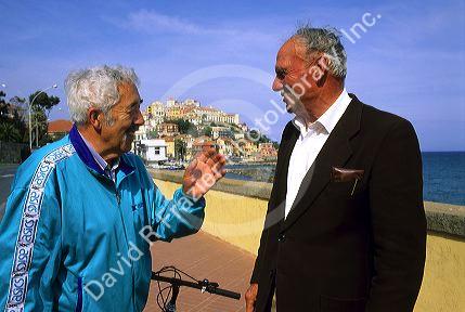 Italian men talking at Imperia, Italy.
