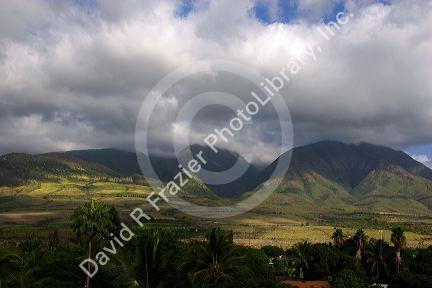 Clouds gather over mountains on the island of Maui, Hawaii.