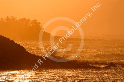 Natural lighting of pacific ocean waves at sunset, Maui, Hawaii.