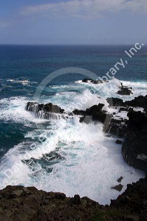 Waves crash in the pacific ocean off the island of Maui, Hawaii.