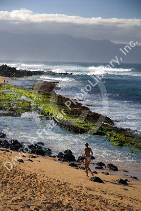 A beach scene on Maui, Hawaii at Lower Paia Beach.