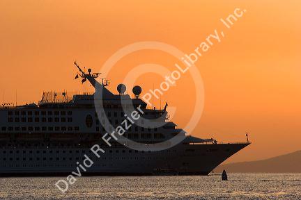 A cruise ship at sunset off the island of Maui, Hawaii.