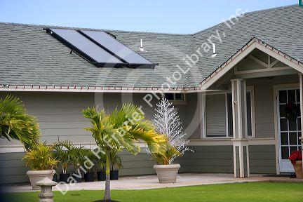 Solar pannels atop the roof of a modern housing developement on the island of Maui, Hawaii.