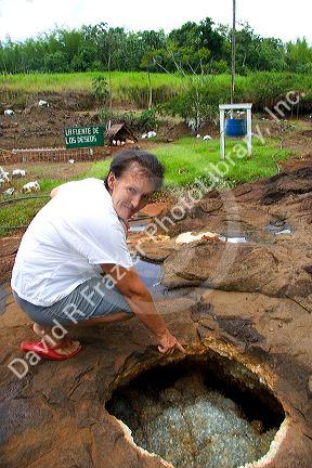 Tour guide points out crystals at a gemstone mine in Libertad, Argentina.
