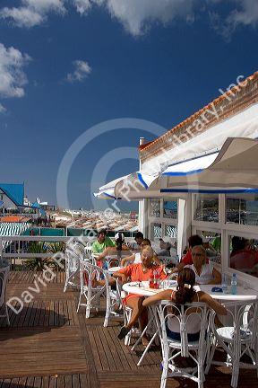 People dine at an outdoor cafe in Pinamar, Argentina.