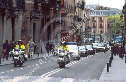 Police motorcade for foreign leader in Madrid, Spain during state funeral for train bombing victims of 3/11/04.