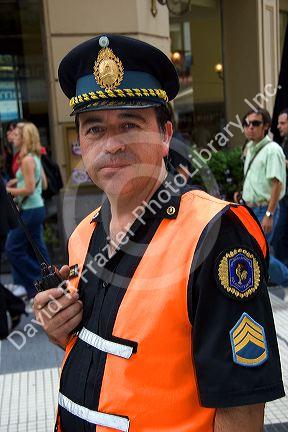 National Police sergeant holding a radio in Buenos Aires, Argentina.