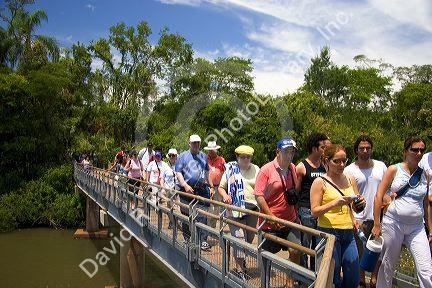 Tourists on walkways at Iguazu Falls, Argentina.
