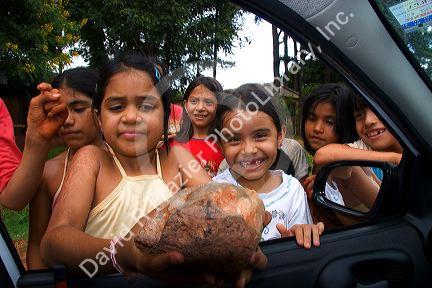 Children selling crystals and gemstones outside a mine in Libertad, Argentina.