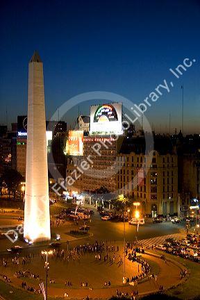 Night time overview of 9th of July Avenue in Buenos Aires, Argentina at Plaza de la Republica with the Obelisk.