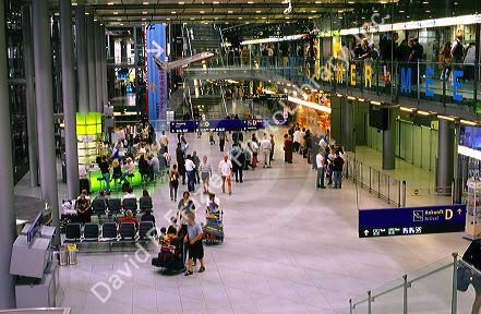 Travelers at the airport terminal in Cologne, Germany.