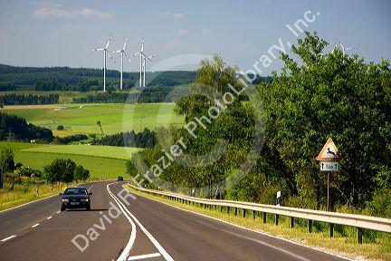 Electricity wind generators and automobiles traveling on the highway in northwest Germany.