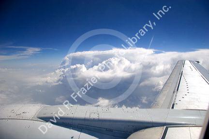 An airliner wing above the clouds.
