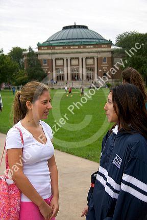 Female students socialize on the campus of the University of Illinois at Champaign.