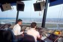 Two men working in an air traffic control tower. Atlanta, Georgia.