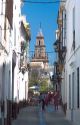 View of a narrow street in ancient roman town of Carmona, Spain.