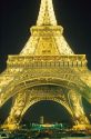 The Eiffel Tower lit up at night in Paris, France.