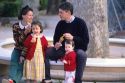 A french family eating ice cream in Paris, France.