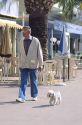 A man walking his dog in southern France.