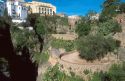 Buildings and walkways on the edge of the gorge in Ronda, Spain.