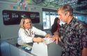 Southwest ticket agent explains ticket and routing to customer at the Boise Airport. (MR)