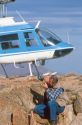 Minerologist examines a rock in the field.