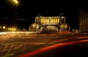Piazza Venezia at night in Rome, Italy.