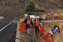 Adopt A Highway volunteers pick up litter.