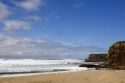 Waves crash onto the beach in north of Santa Cruz, Califronia.