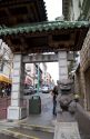 Stone figure of a dragon sits at the entrance to Chinatown, San Francisco, California on Grant Street at Bush.