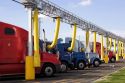 Trucks parked at a truck stop using the yellow tubes for air conditioning. Medera, California.