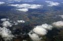 Clouds above farm land.