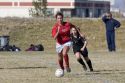 High school girls playing soccer.