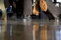 Feet walking at an airport.