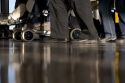 Feet walking at an airport.