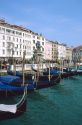 Goldolas lined up in Venice, Italy near Piazza San Marco.