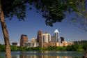 Cityscape skyline view of Austin, Texas with City Lake in the foreground.