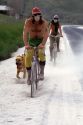 People ride bicycles through ash in the aftermath of the Mount St. Helens eruption in 1980. Moscow, Idaho.