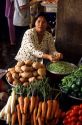 A street vendor selling vegetables in Saigon, Vietnam.