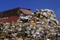 A large dumpster unloads trash at a sanitary landfill in Boise, Idaho.