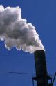 Smoke stacks emit air pollution at a manufacturing plant.