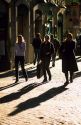 Pedestrians walking along the Via Della Croce in Rome, Italy.