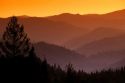 Hazy mountains and forest at sunset in Central Idaho.