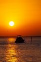 A fishing boat at sunset in Punta Gorda, Florida.