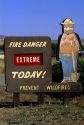 A forest service sign with Smokey Bear warning of extreme fire danger in Idaho.