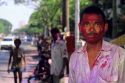 An Indian man wearing Holi Festival colors in India.